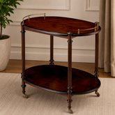 Classic oval teak wood serving trolley with brass rail and caster wheels