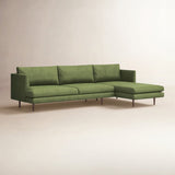 Luxury green velvet L-shaped sofa by Sky Rise Decor