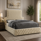cream tufted upholstered bed with wingback headboard