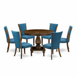 Elegant round pedestal dining table with blue fabric chairs