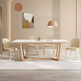 minimalist dining table with wooden base and upholstered chairs