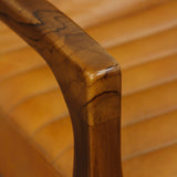 Handcrafted teak wood armchair with cushioned leather seat and backrest