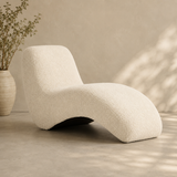 Modern curved bouclé lounge chair with teak wood frame in cream upholstery