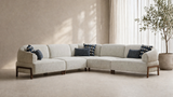 Modern curved cream boucle sectional sofa with teak wood base