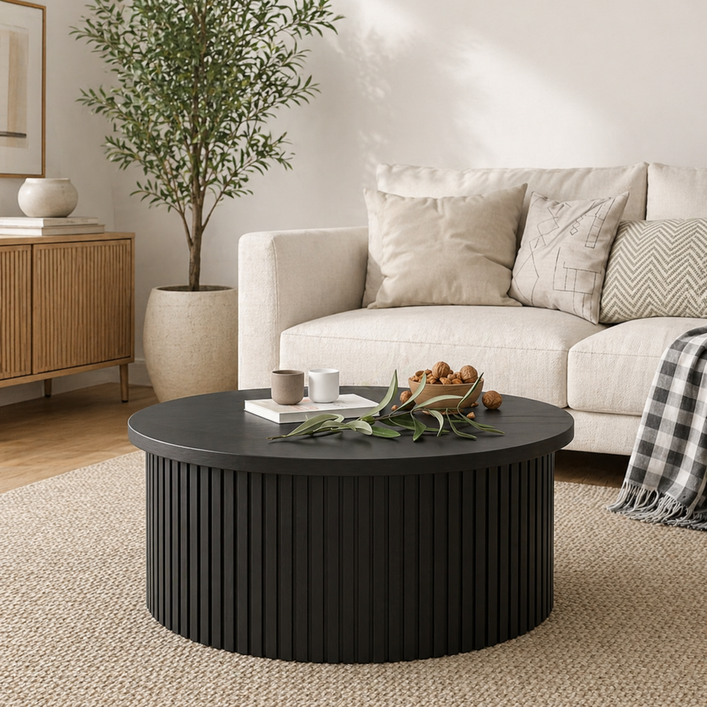 Modern black fluted round coffee table in contemporary living room