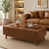 Modern fluted oval coffee table in walnut finish with open shelf storage