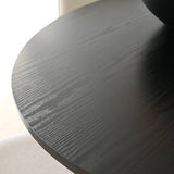 Stylish round dining table with cushioned chairs