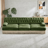 Olive green button tufted sofa with decorative fringe