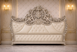 Ornate hand carved king bed headboard detail with premium silver finish and classic European design