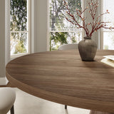 “Elegant round table with cushioned dining chairs”