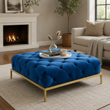 Royal blue velvet tufted ottoman coffee table with gold metal base and teak wood frame