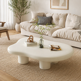 Modern cloud shaped ivory coffee table in minimalist living room
