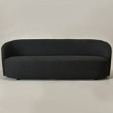 Modern curved black sofa in premium bouclé fabric