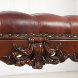 Classic brown leather bench with carved teak wood