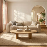 Contemporary cream fabric sofa with teak wood frame