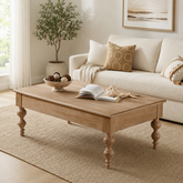 Solid teak wood coffee table with turned legs in living room