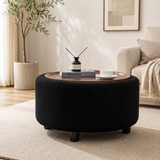 Round teak wood coffee table with black upholstered ribbed ottoman base