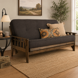 Solid teak wood futon sofa bed with charcoal grey cushions in modern living room
