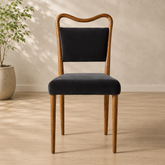 Solid teak wood dining chair with black upholstered seat