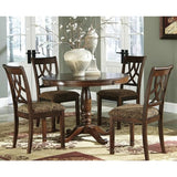 Elegant brown dining chairs with patterned upholstery