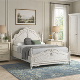 Vintage white carved bed frame with ornate headboard