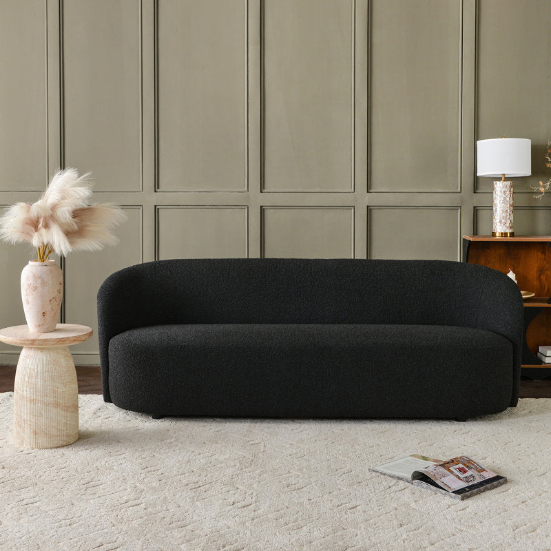 Elegant curved black living room sofa with teak wood frame