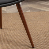 Black leatherette dining chair with wooden legs