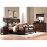 Dark wood sleigh bed in classic bedroom setting