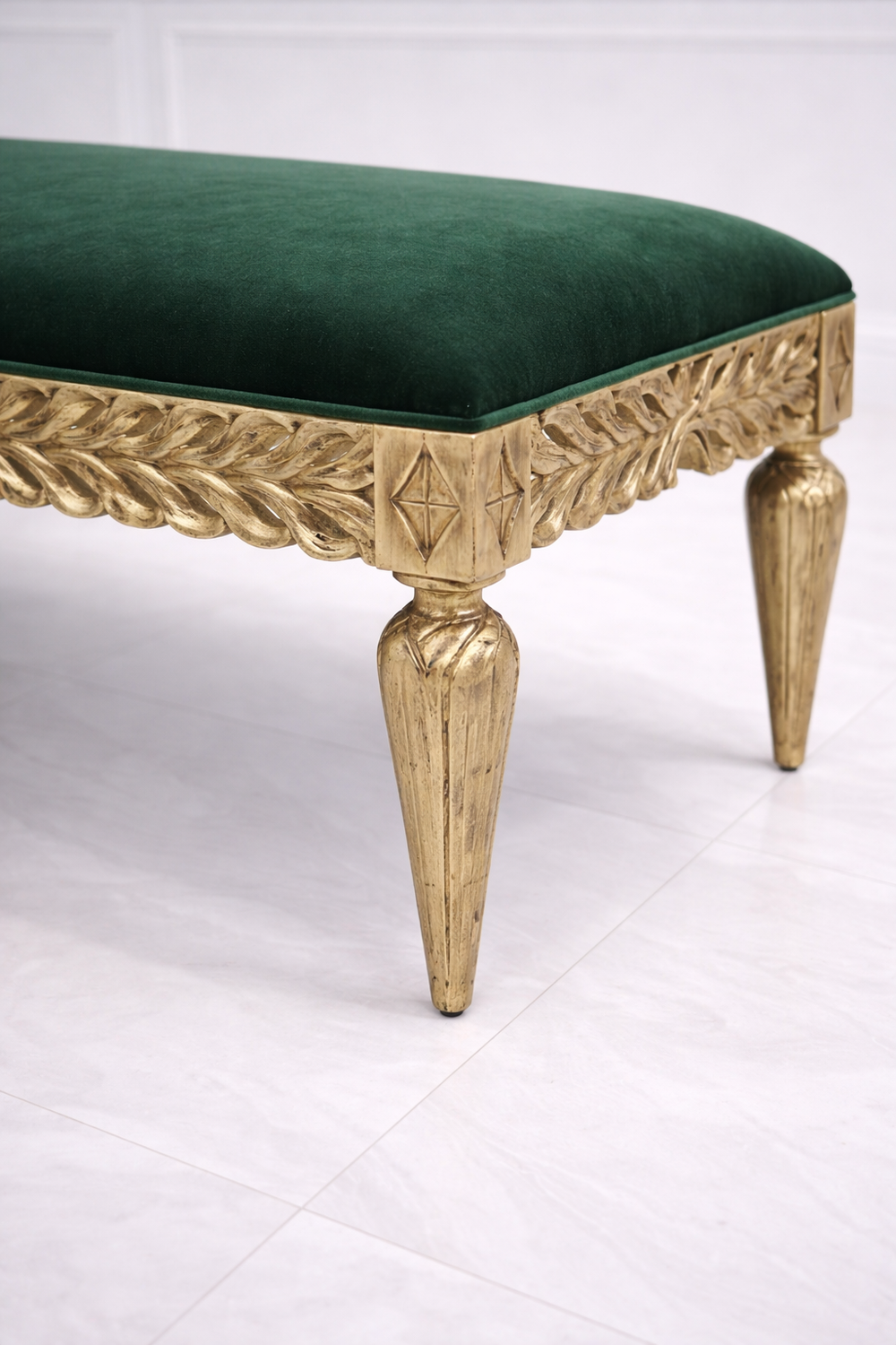 Classic carved wooden bench with green upholstered seat for hallway décor
