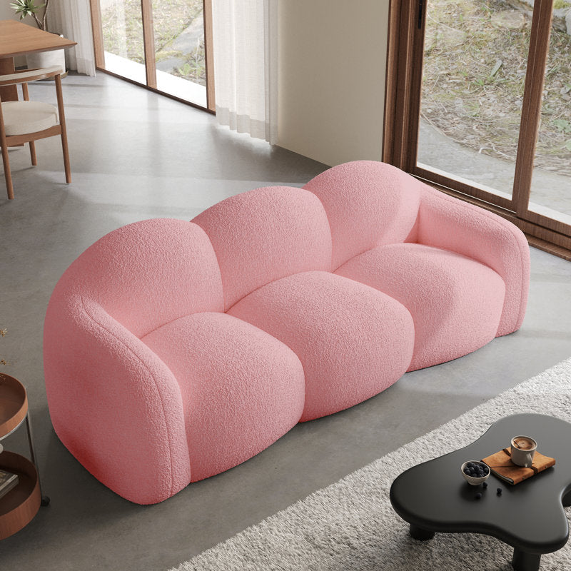 Pink curved sofa with teak-wood frame