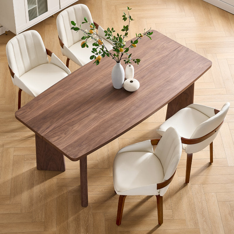 Stylish wooden dining table with modern white chairs