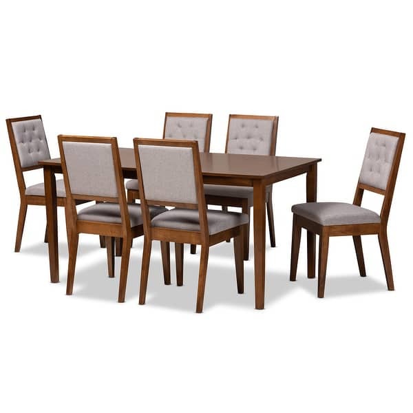 Contemporary dining table with cushioned chairs