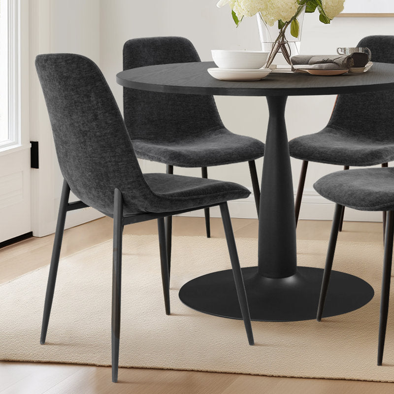 Designer black round dining table for luxury interiors