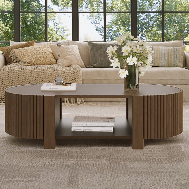 Luxury oval wood coffee table with fluted base and open shelf storage