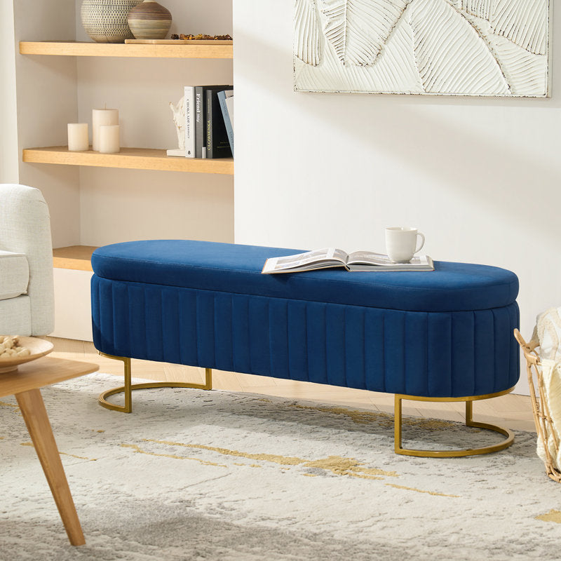 Modern navy blue upholstered storage bench with gold accents