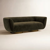 Contemporary designer sofa with curved armrests and teak wood frame
