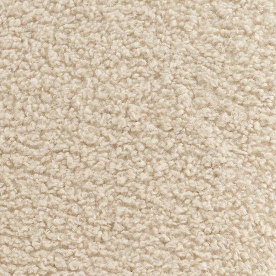 Luxury accent chair crafted from teak wood and soft bouclé fabric