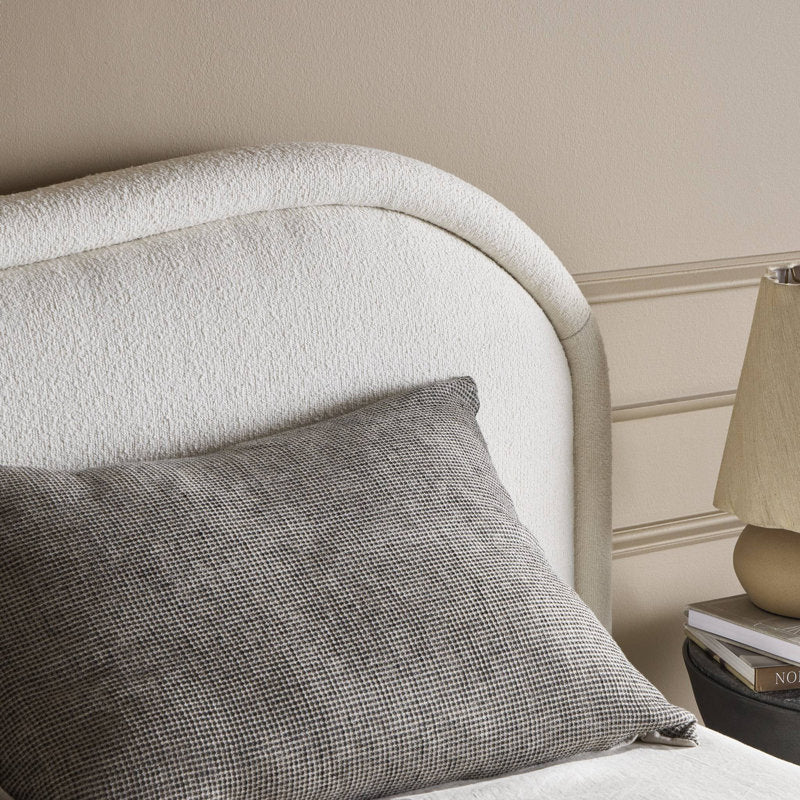 Elegant cream fabric bed made from solid teak wood