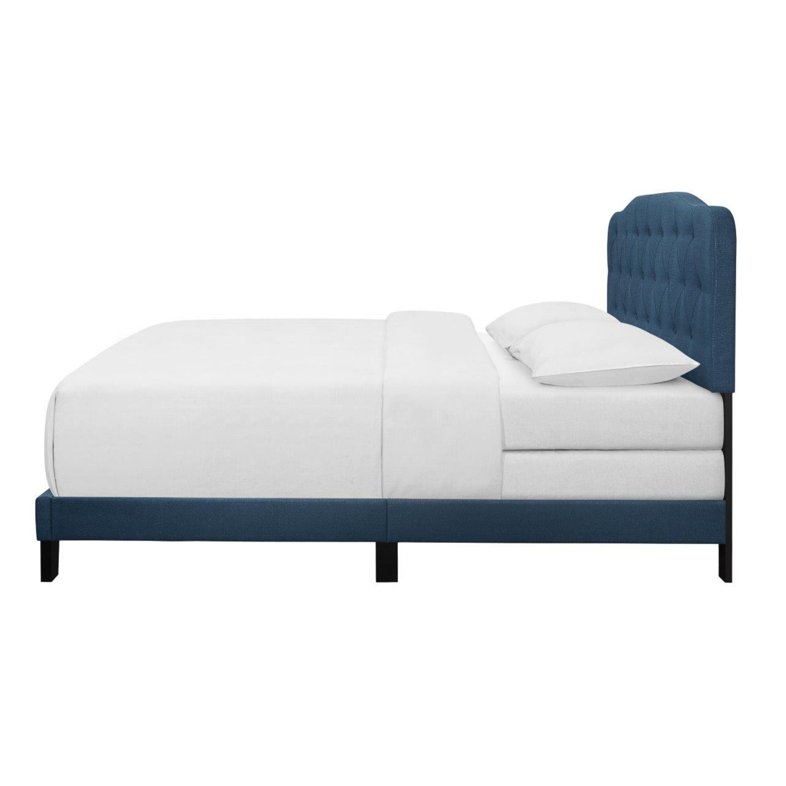 blue fabric bed with wooden legs