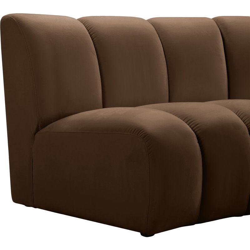 Designer living room sofa with modern curved seating