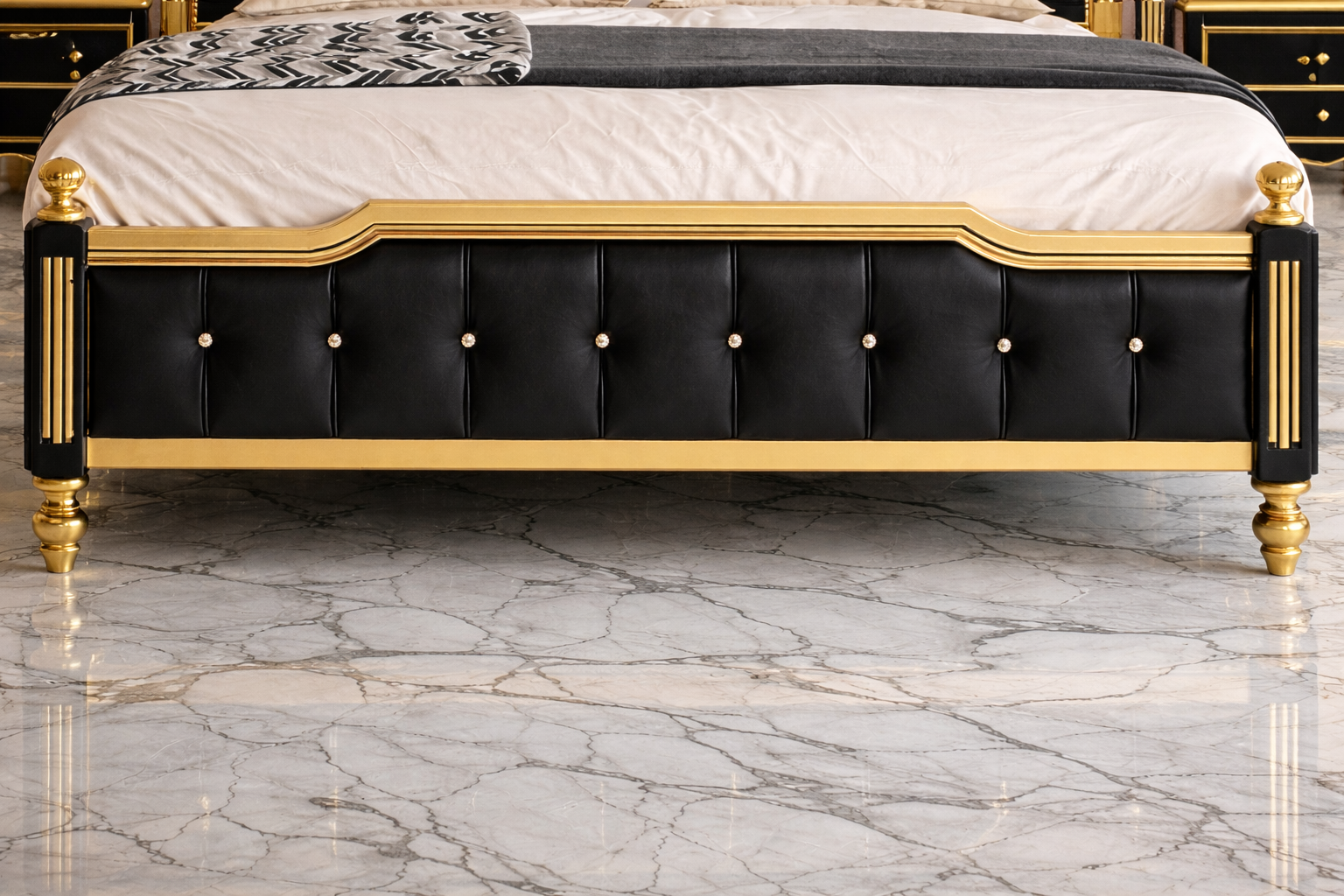 Luxury black king bed footboard with gold trim detailing
