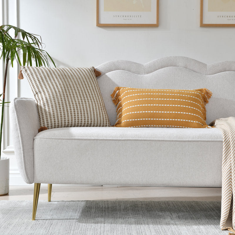 Beige curved couch with premium fabric upholstery