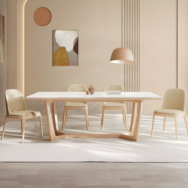 minimalist dining table with wooden base and upholstered chairs