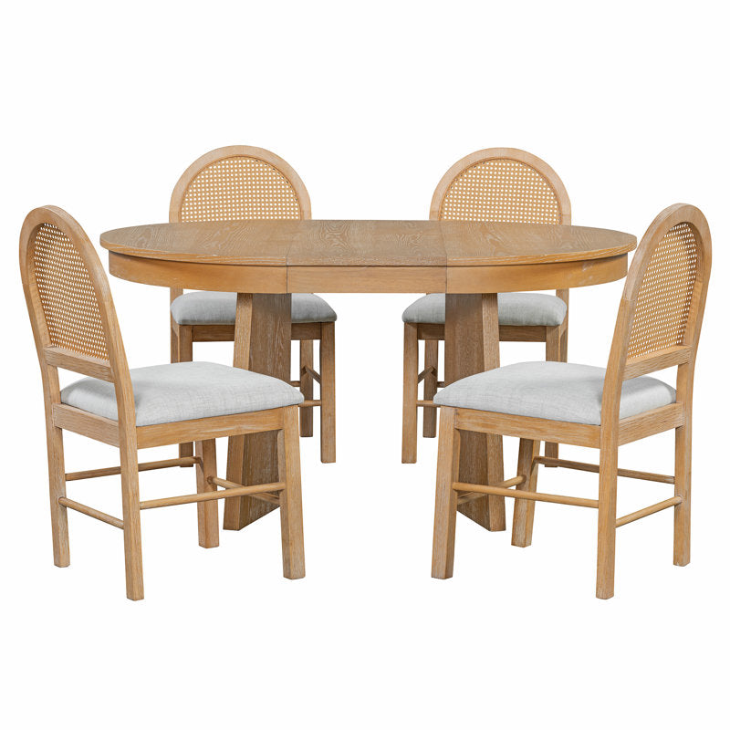 Modern teak wood dining table with cushioned cane back chairs