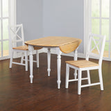 Farmhouse style wooden dining table with white chairs