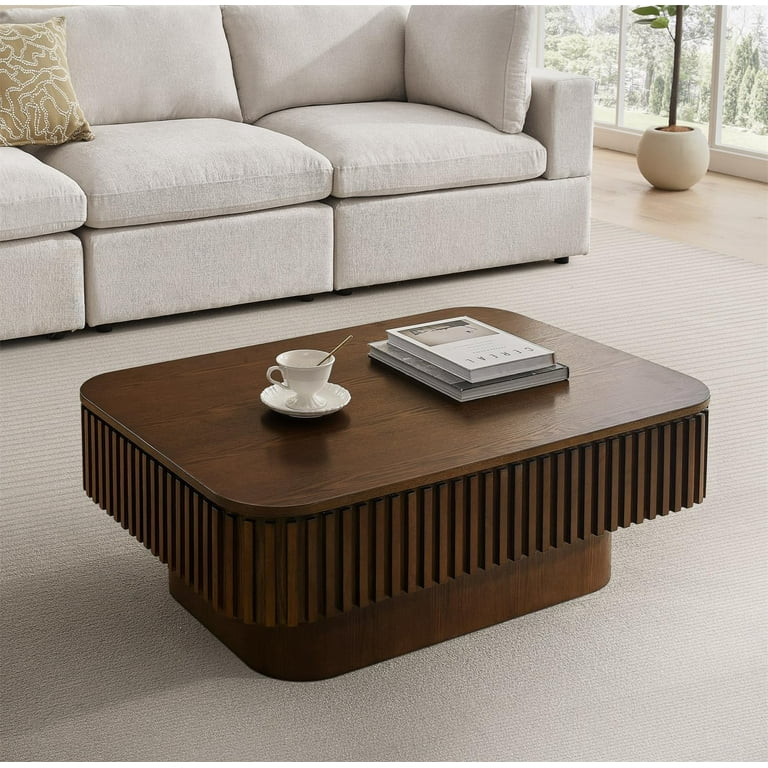 Lift-top coffee table with hidden compartment in living room