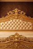 Palace style gold carved bed with tufted headboard

