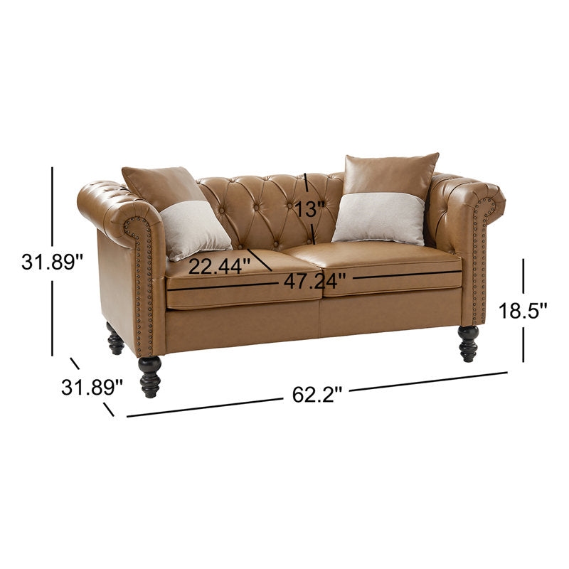 Brown Chesterfield loveseat with rolled arms and nailhead trim