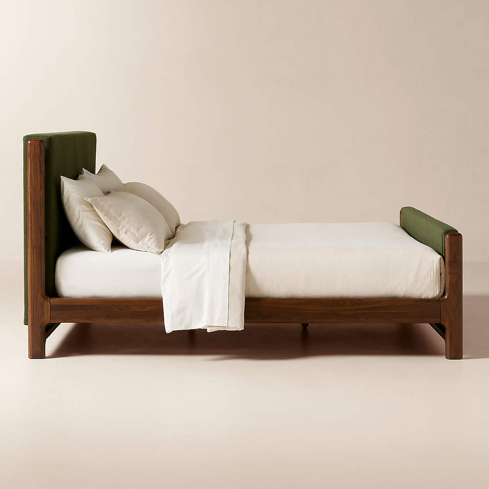 Elegant green upholstered bed with teak wood finish