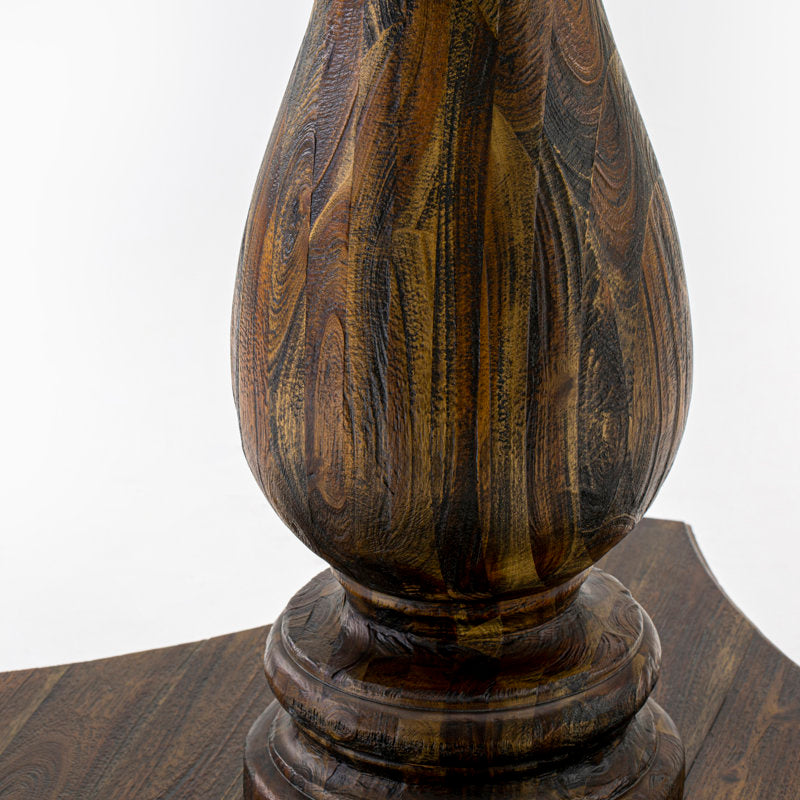 Traditional teak dining table with pedestal base and blue chairs